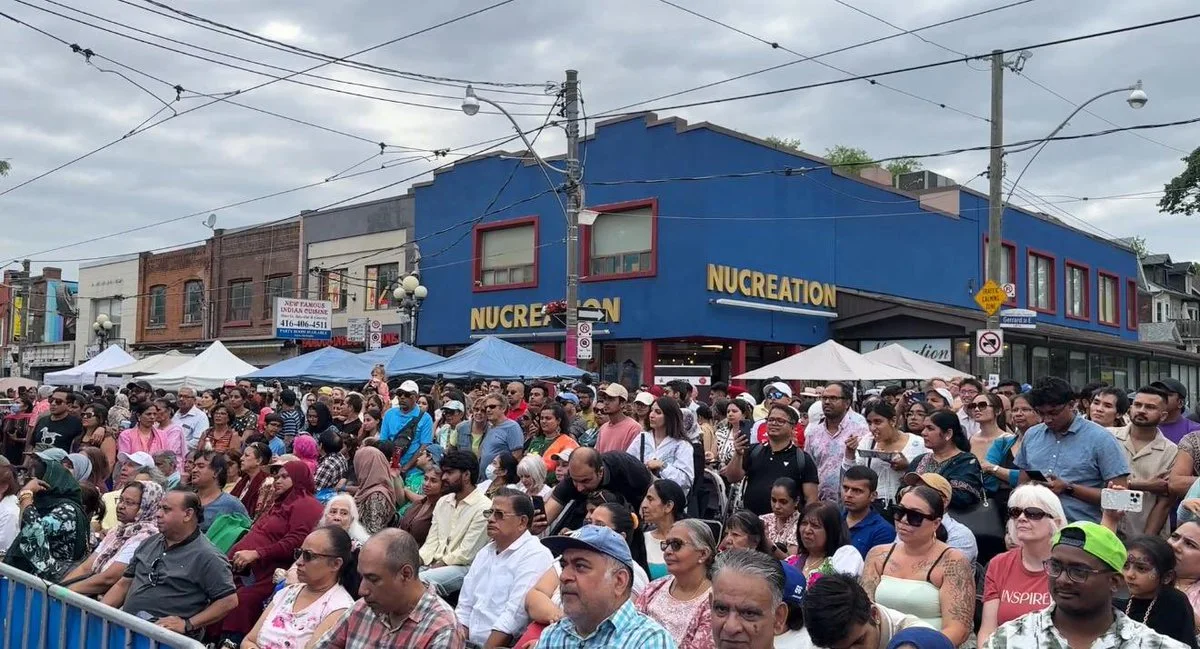 Festival visitors beside Gerrard India Bazaar storefronts in a BIA photograph