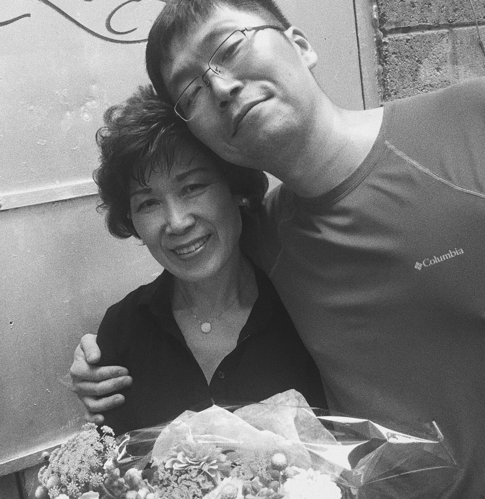 Two people standing together in a photograph shared by Kimchi Korea House