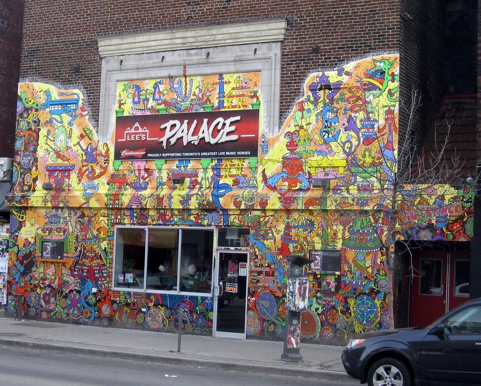 The mural-covered exterior of Lee's Palace on Bloor Street West