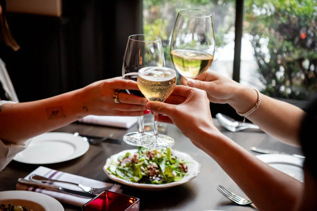Guests raising glasses at Biff’s Bistro