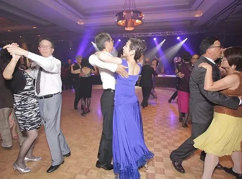 Ballroom dancers in the class image published by Macao Club